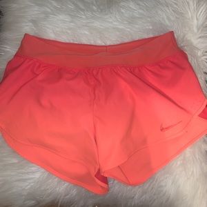 Orange Nike Dry fit running/ athletic shorts.